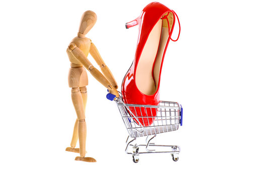 Wooden Doll buys shoes in a shopping cart-cut out