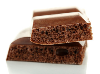 Tasty porous chocolate, isolated on white