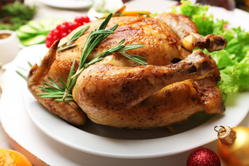 Baked chicken for festive dinner. Christmas table setting