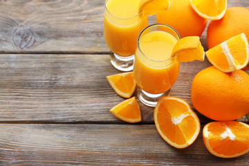 Freshly squeezed orange juice on wooden table