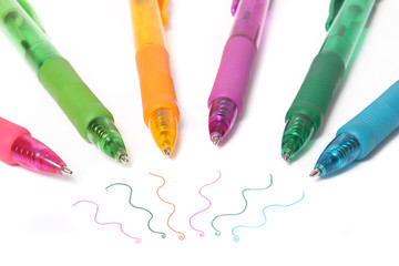 Colorful writing pens with squiggles