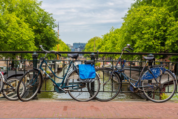 Fototapeta premium Bicycles on a bridge over the canals of Amsterdam