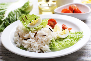 Boiled rice served on table, close-up