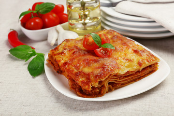 Portion of tasty lasagna on table