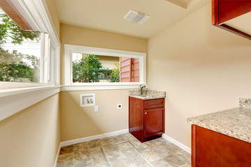 Soft tones empty laundry room