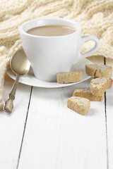Coffee with cookies and knitwear