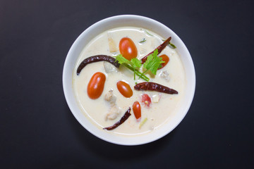 Coconut milk soup with chicken isolated background