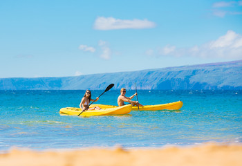 Man and Woman Kayaking in the Ocean