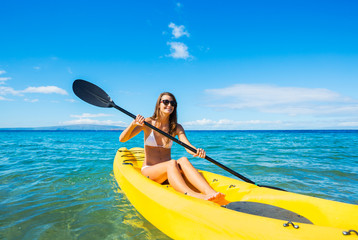 Woman Kayaking in the Ocean on Vacation