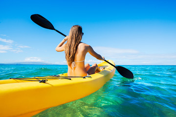 Woman Kayaking in the Ocean on Vacation - 74316640