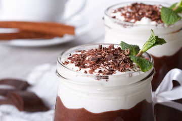 chocolate mousse with whipped cream in a jar. macro