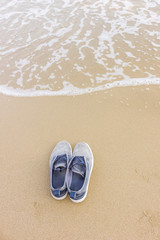 Fototapeta na wymiar Shoes on the beach