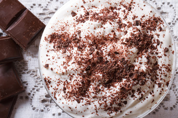 whipped cream with dark chocolate close-up. top view