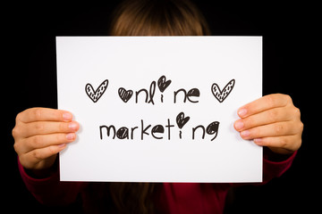 Person holding Online Marketing sign