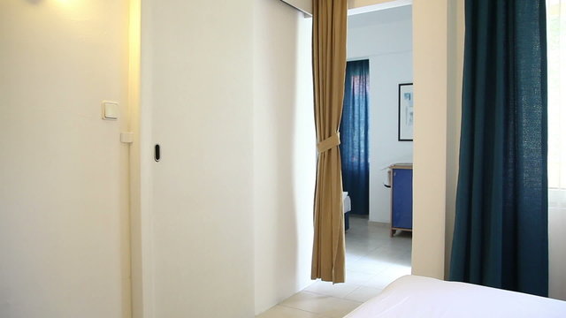 woman in a hotel room gets cream on face 2