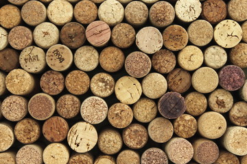 many different wine corks in the background