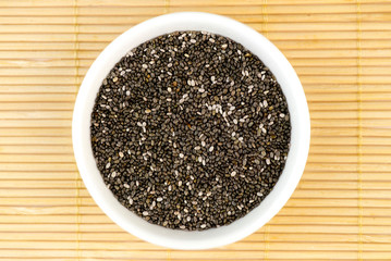 Aerial closeup of chia seeds on bamboo mat