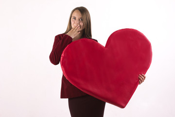 beautiful woman holding a big heart