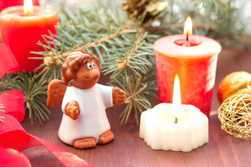 Small angel with christmas decoration
