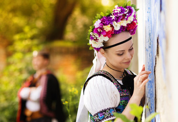 Couple in love with traditional folk costumes