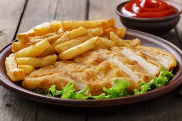 breaded chicken schnitzel with potatoes