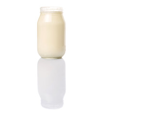 Mayonnaise in a jar over white background