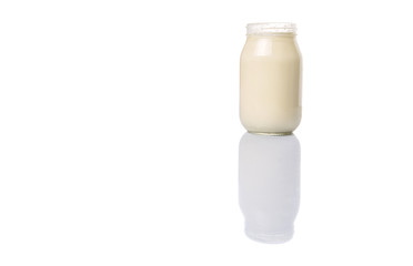 Mayonnaise in a jar over white background