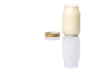 Mayonnaise in a jar over white background