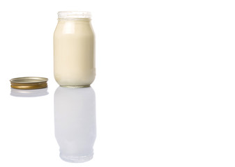 Mayonnaise in a jar over white background