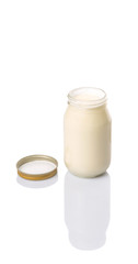 Mayonnaise in a jar over white background