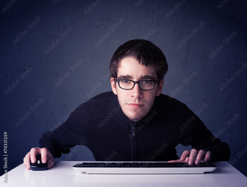 Fototapete hacker working with keyboard on blue background