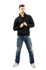 Fototapeta premium Young fashion model holding hoodie laces