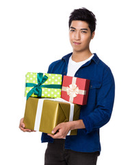 Man hold with lots of giftbox