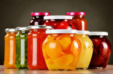 Jars with fruity compotes and jams. Preserved fruits