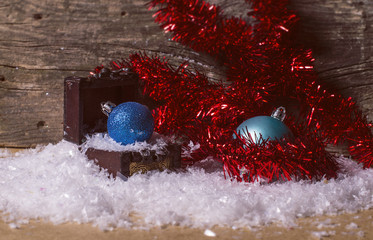 Blue christmas baubles and red tinsel