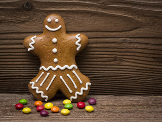 Gingerbread and candy on wooden background