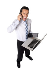 overworked senior businessman multitasking in stress