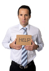 senior businessman holding help sign in overwork stress concept