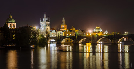 Fototapeta na wymiar Night view of Vltava river and bridges in Prague