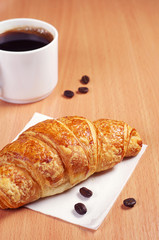 Croissant and coffee cup