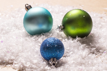 Three colorful christmas baubles