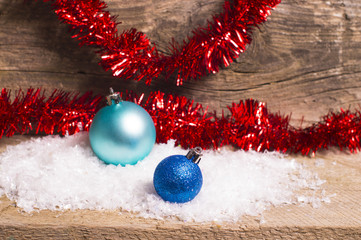 Blue christmas baubles and red tinsel