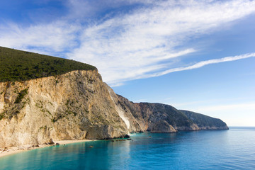 Obraz premium beach with blue water and cliffs