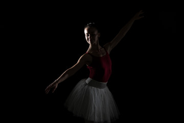 Fototapeta na wymiar Silhouette Of Ballerina In The Black Studio