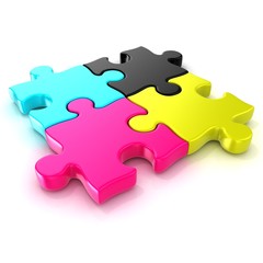 Obraz premium Four CMYK jigsaw puzzle pieces. Isolated on a white background. 