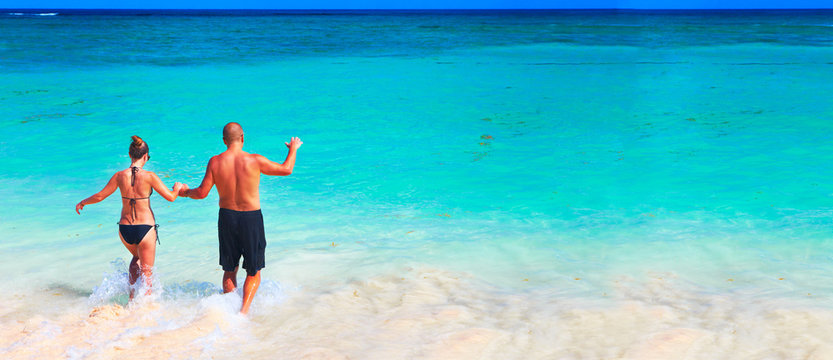Loving couple relaxing on beach