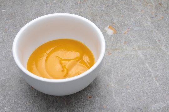mango fruit puree in white bowl