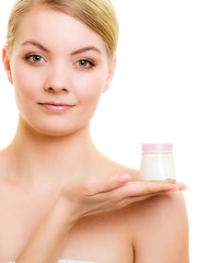 Obraz na płótnie Canvas Skin care. Girl applying moisturizing cream.