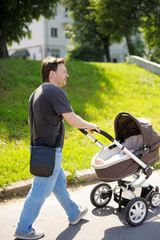 Man walking with baby stroller