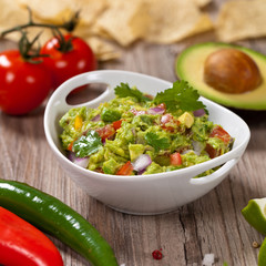 Guacamole with avocado, lime, tomato and cilantro